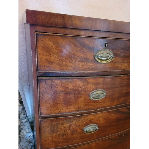 206 - A 19TH CENTURY BOW FRONTED MAHOGANY CHEST OF DRAWERS, 2 over 3, each drawer with brass swing handle ... 