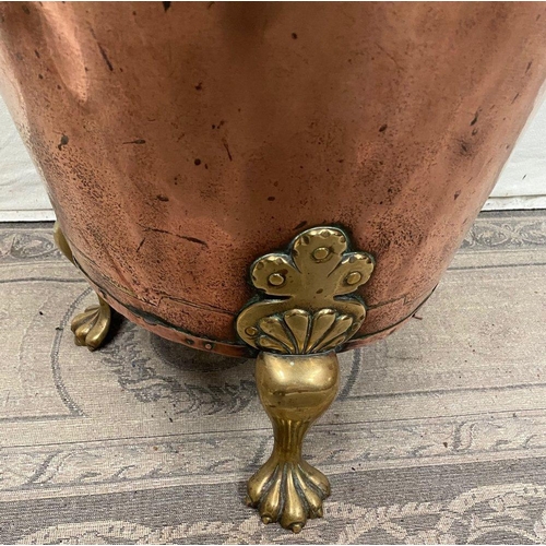 211 - A GEORGIAN COPPER AND BRASS COAL / LOG BUCKET, with lion head rings to the sides of the tapered body... 