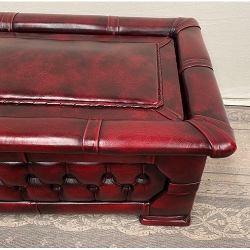 213 - A CHESTERFIELD STYLE OTTOMAN FOOT STOOL, with hinged lid, button detail to the sides, perfect match ... 