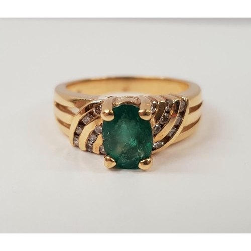 217 - A 14CT YELLOW GOLD EMERALD AND DIAMOND RING, with oval central emerald stone, with diamond accented ... 