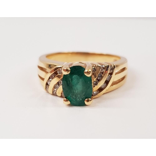 217 - A 14CT YELLOW GOLD EMERALD AND DIAMOND RING, with oval central emerald stone, with diamond accented ... 