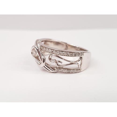 222 - A WHITE GOLD DIAMOND LOVE KNOT RING, of contemporary design, with the largest diamond set in a Love ... 