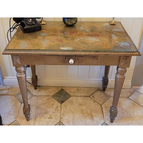 224 - A 20TH CENTURY GILDED SINGLE DRAWER HALL TABLE, with gadrooned rim and glass panel top, raised on tu... 