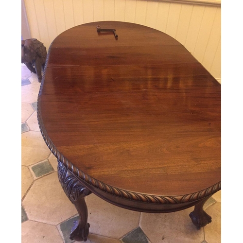 239 - A MAHOGANY OVAL DINING TABLE, extendable, on cabriole leg, claw and ball feet, castor wheels, two le... 