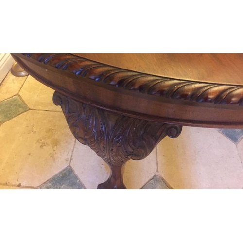 239 - A MAHOGANY OVAL DINING TABLE, extendable, on cabriole leg, claw and ball feet, castor wheels, two le... 