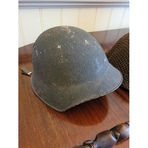 240 - A MIXED MILITARY INTEREST LOT, includes two helmets, one of which is a WWI helmet the other reproduc... 