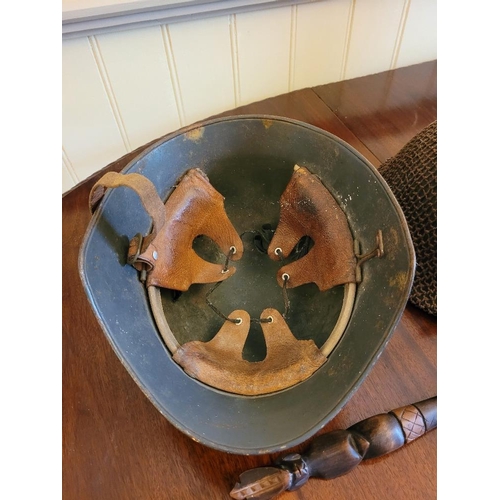 240 - A MIXED MILITARY INTEREST LOT, includes two helmets, one of which is a WWI helmet the other reproduc... 