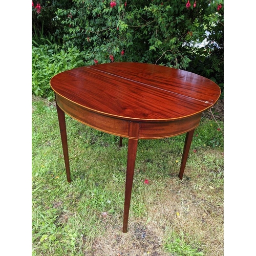 34 - A VERY FINE GEORGIAN MAHOGANY FOLD OVER TEA TABLE, circa 1800, with D shaped top having satinwood st... 