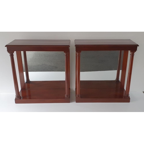 45 - A VERY FINE PAIR OF MAHOGANY CONSOLE TABLES, with mirrored back panel and a simple turned column sup... 