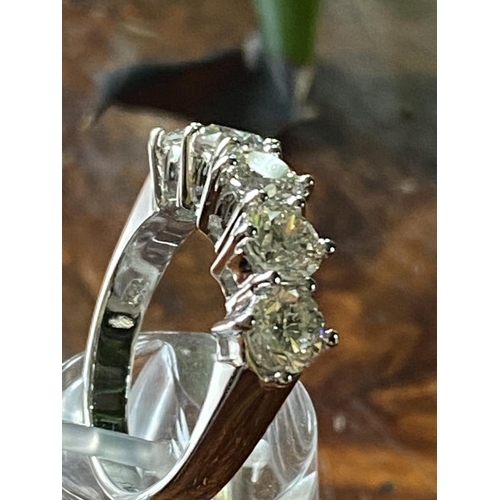 49 - AN 18CT WHITE GOLD FIVE STONE DIAMOND RING, claw set, with a total of 2.55cts of round brilliant cut... 