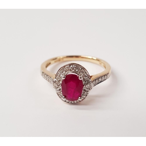 58 - A BEAUTIFUL 9CT YELLOW GOLD RUBY AND DIAMOND HALO RING, with a stunning central oval shaped ruby sto... 