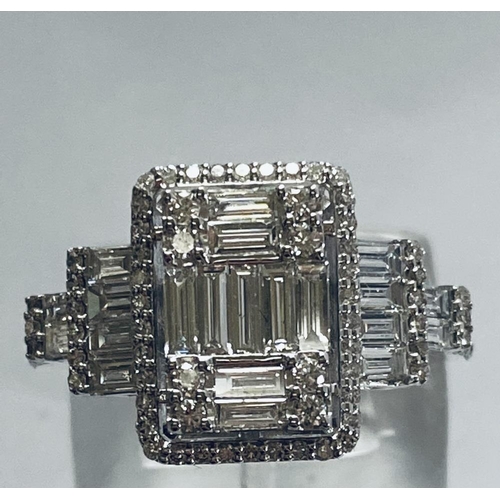 6 - A VERY IMPRESSIVE 18CT WHITE GOLD DIAMOND CLUSTER RING, with an arrangement of baguette and brillian... 