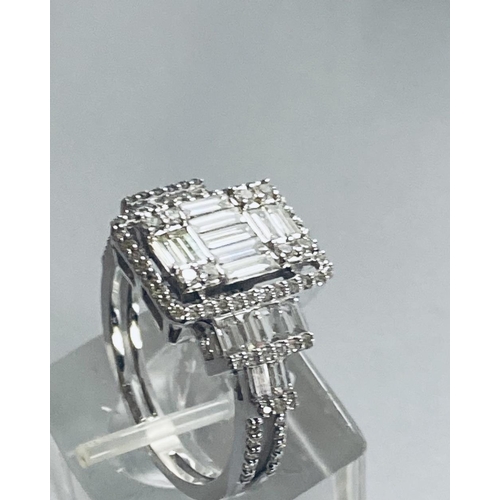 6 - A VERY IMPRESSIVE 18CT WHITE GOLD DIAMOND CLUSTER RING, with an arrangement of baguette and brillian... 