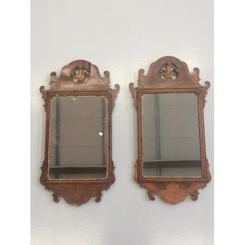 68 - A PAIR OF 19TH CENTURY CHIPPENDALE STYLE WALL MIRRORS, with scrolling detail to the shaped frame, th... 