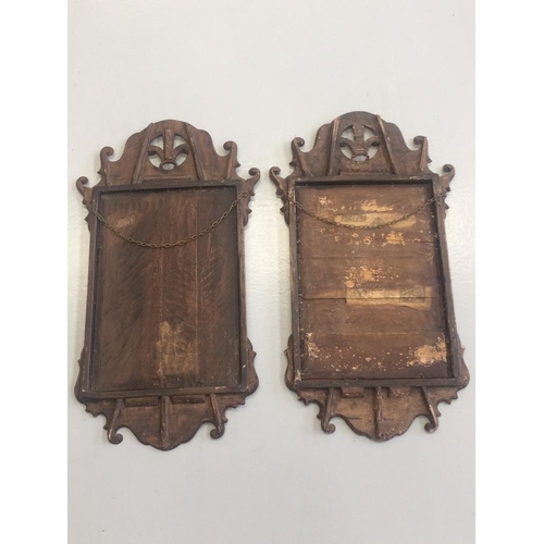 68 - A PAIR OF 19TH CENTURY CHIPPENDALE STYLE WALL MIRRORS, with scrolling detail to the shaped frame, th... 