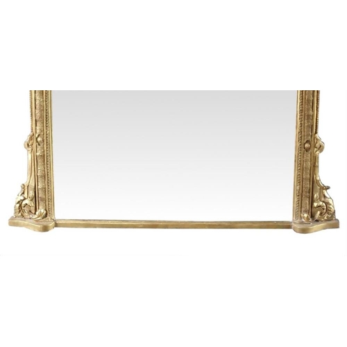 81 - A FINE 19TH CENTURY GILT OVER MANTLE MIRROR, with arched top, decorated with beaded detail and scrol... 