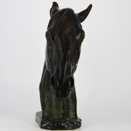 83 - A BRONZE HEAD OF A HORSE, on a green marble stone base, inscribed Albert Hienrich Hussmann to the sc... 