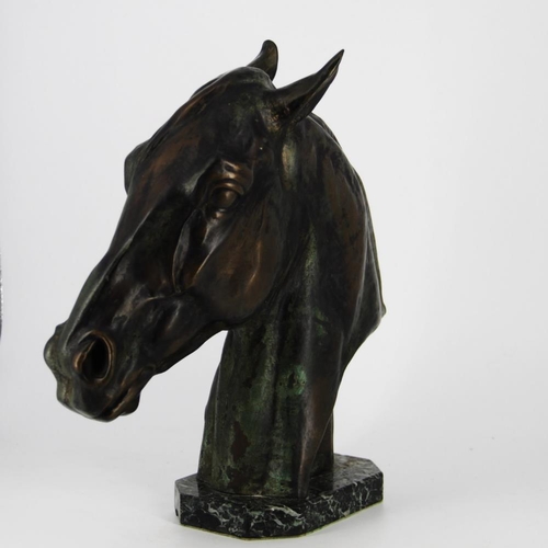 83 - A BRONZE HEAD OF A HORSE, on a green marble stone base, inscribed Albert Hienrich Hussmann to the sc... 