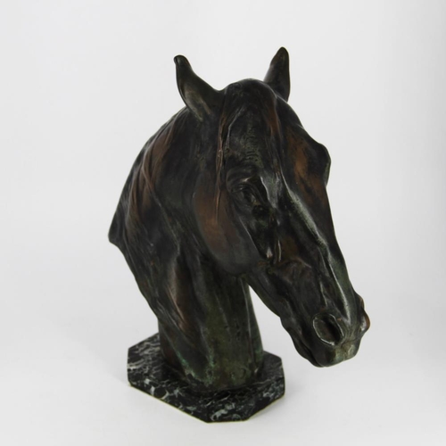 83 - A BRONZE HEAD OF A HORSE, on a green marble stone base, inscribed Albert Hienrich Hussmann to the sc... 