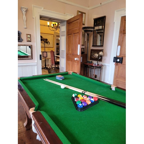 87 - AN E. J RILEY SNOOKER DINING TABLE, comes with snooker cues, set of balls and a score board. Table h... 