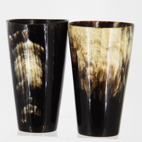 91 - A PAIR OF DRINKING HORN MUGS, one with a silver crest shaped cartouche, Dublin date letter of 2001, ... 