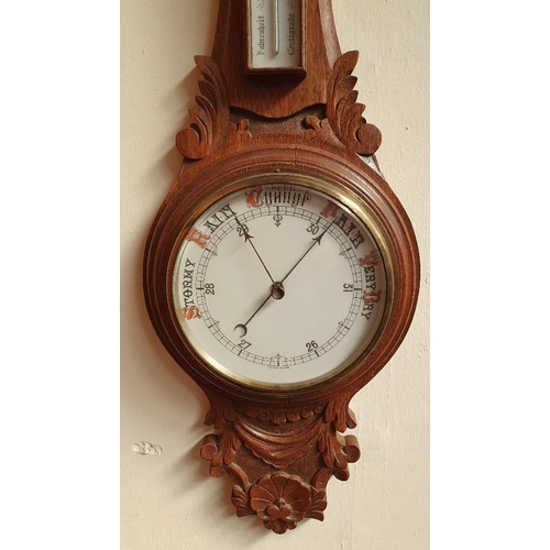 95 - A GOOD QUALITY 19TH CENTURY CARVED OAK WALL BAROMETER, with built in thermometer, in excellent condi... 