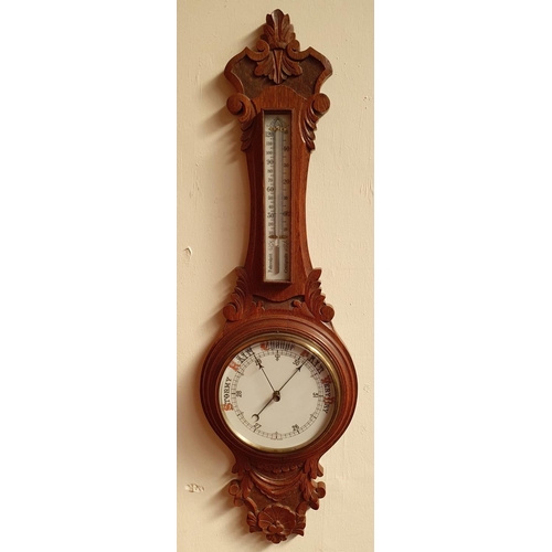 95 - A GOOD QUALITY 19TH CENTURY CARVED OAK WALL BAROMETER, with built in thermometer, in excellent condi... 