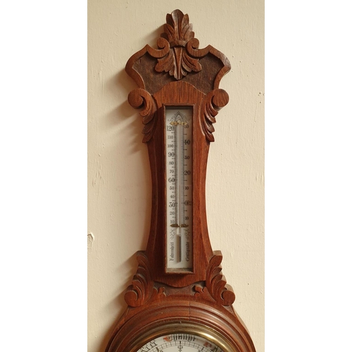 95 - A GOOD QUALITY 19TH CENTURY CARVED OAK WALL BAROMETER, with built in thermometer, in excellent condi... 