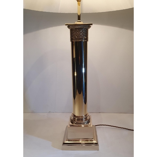 96 - A FINE POLISHED BRASS TABLE LAMP, in excellent condition, with shade, 95.3cm tall x 18.5cm wide x 18... 