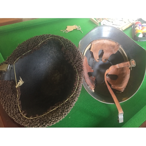 240 - A MIXED MILITARY INTEREST LOT, includes two helmets, one of which is a WWI helmet the other reproduc... 