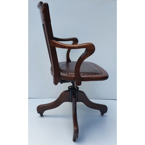 78 - A GOOD QUALITY EDWARDIAN OAK SWIVEL & TILT OFFICE CHAIR, by Ford & Johnson, Chicago.