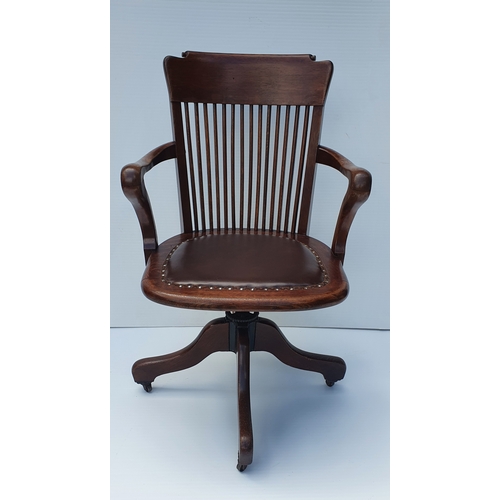 78 - A GOOD QUALITY EDWARDIAN OAK SWIVEL & TILT OFFICE CHAIR, by Ford & Johnson, Chicago.