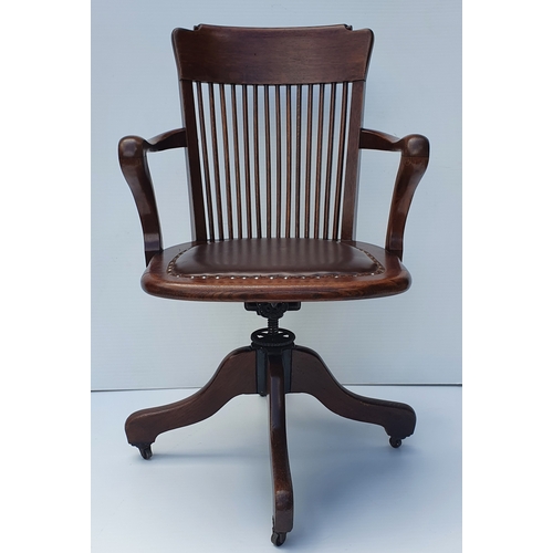 78 - A GOOD QUALITY EDWARDIAN OAK SWIVEL & TILT OFFICE CHAIR, by Ford & Johnson, Chicago.