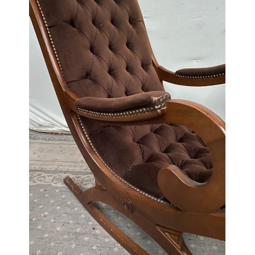 103 - A REGENCY STYLE BUTTON BACK & SEAT ROCKING CHAIR, mahogany framed with scrolling armrest shape, upho... 