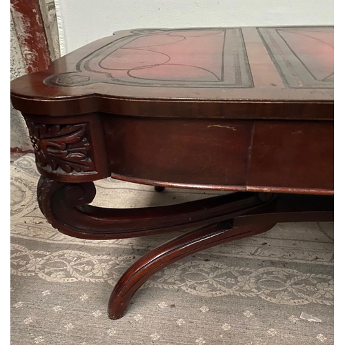 104 - A LOW RISE MAHOGANY LEATHER TOPPED COFFEE TABLE, with a pair of drawers to the front, the leather to... 