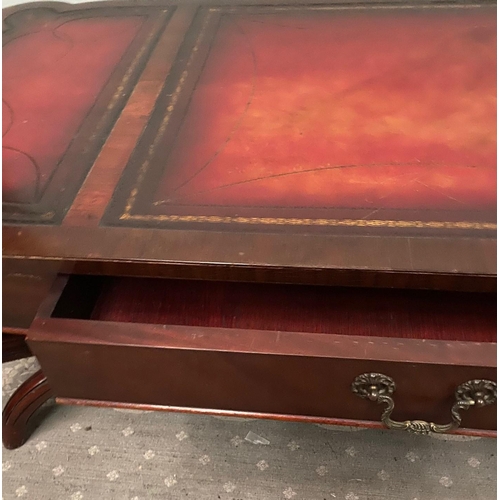 104 - A LOW RISE MAHOGANY LEATHER TOPPED COFFEE TABLE, with a pair of drawers to the front, the leather to... 