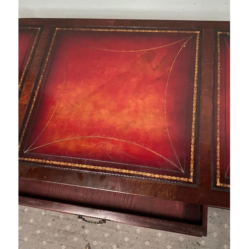 104 - A LOW RISE MAHOGANY LEATHER TOPPED COFFEE TABLE, with a pair of drawers to the front, the leather to... 