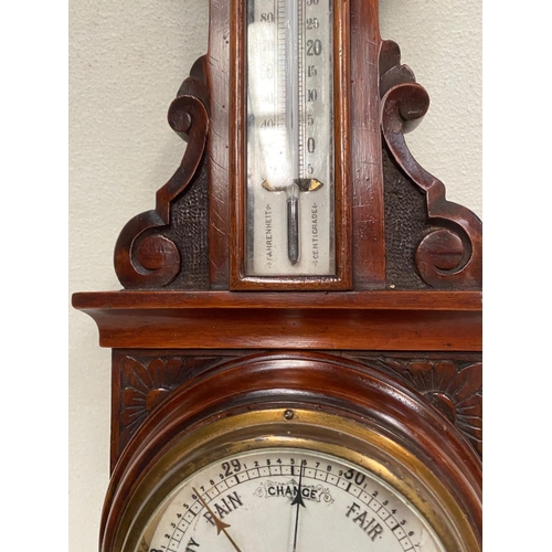 108 - A 19TH CENTURY MAHOGANY CARVED BAROMETER, nicely decorated all over with floral carved design and a ... 