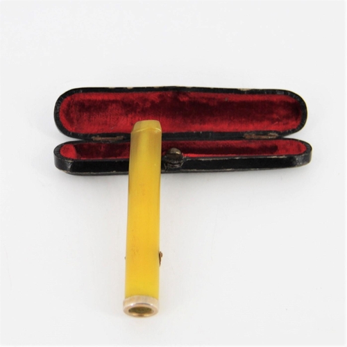 115 - A CASED YELLOW AMBER CIGARETTE HOLDER with gold clip and base, presented in the original case with v... 