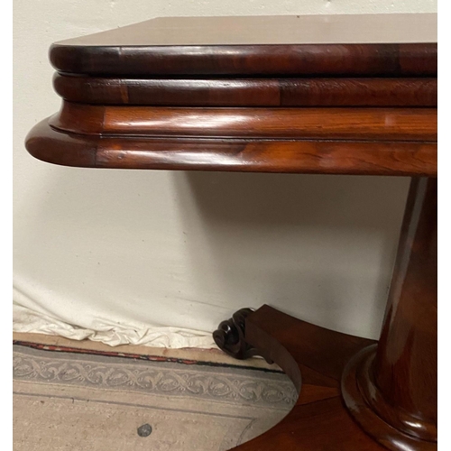 12 - A VERY FINE ROSEWOOD WILLIAM IV FOLD OVER CARD TABLE, with rounded edges to the fold over top, which... 