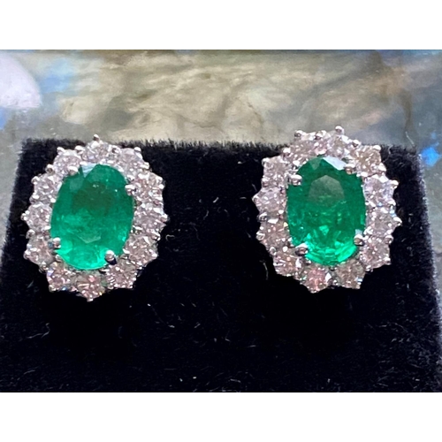 13 - AN ATTRACTIVE PAIR OF 18CT WHITE GOLD EMERALD & DIAMOND EARRINGS; this fantastic pair make an instan... 