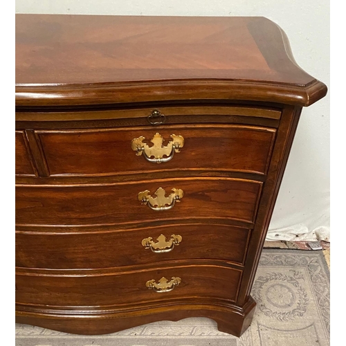 14 - A FINE GEORGIAN STYLE MAHOGANY SERPENTINE SHAPED CHEST OF DRAWERS, with cross-banded top and moulded... 