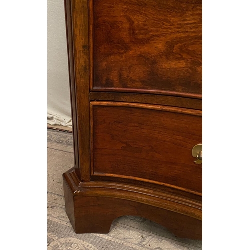 14 - A FINE GEORGIAN STYLE MAHOGANY SERPENTINE SHAPED CHEST OF DRAWERS, with cross-banded top and moulded... 