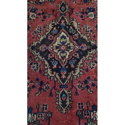 148 - A GOOD QUALITY HAND-WOVEN PERSIAN SAROUK FLOOR RUG, with multiple boarders each filled with floral d... 