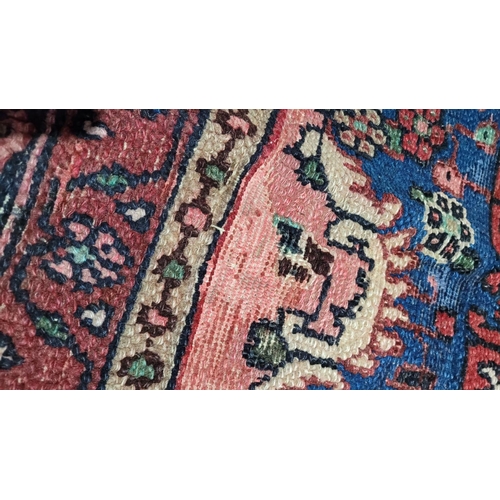 148 - A GOOD QUALITY HAND-WOVEN PERSIAN SAROUK FLOOR RUG, with multiple boarders each filled with floral d... 