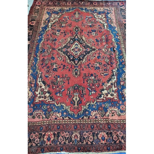 148 - A GOOD QUALITY HAND-WOVEN PERSIAN SAROUK FLOOR RUG, with multiple boarders each filled with floral d... 