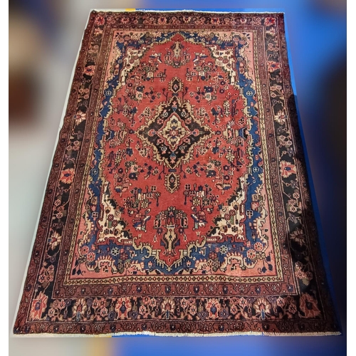 148 - A GOOD QUALITY HAND-WOVEN PERSIAN SAROUK FLOOR RUG, with multiple boarders each filled with floral d... 