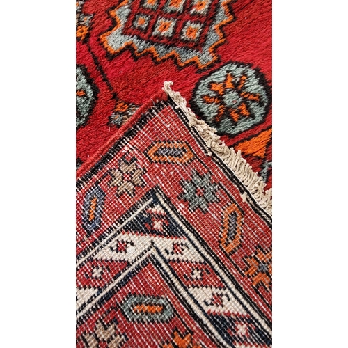 149 - A GOOD QUALITY PERSIAN MESHKIN FLOOR RUNNER, with geometric pattern, with six central medallions sur... 