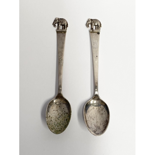 159 - MIXED LOT OF SPOONS; includes; (i) A PAIR OF STERLING SILVER SPOONS, marked sterling 925, with eleph... 