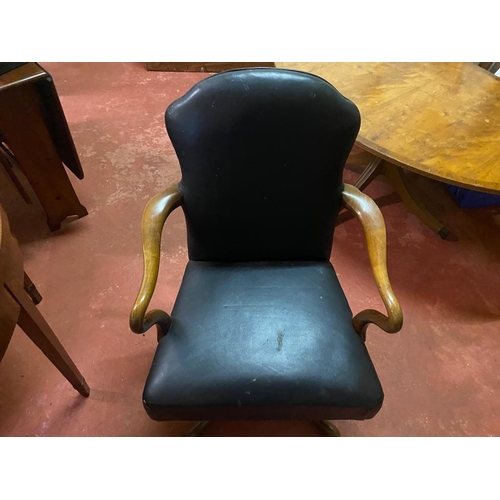 176 - A LATE 19TH CENTURY REVOLVING LEATHER OFFICE / DESK CHAIR, with padded back and seat having curved a... 